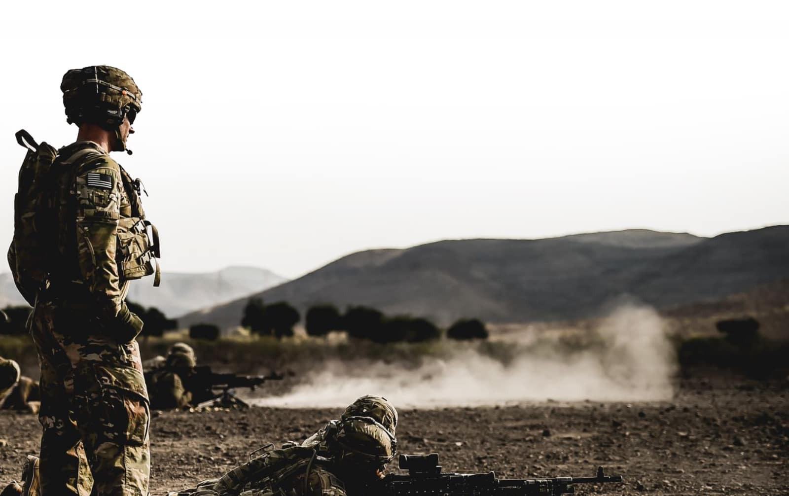 military member on field in combat