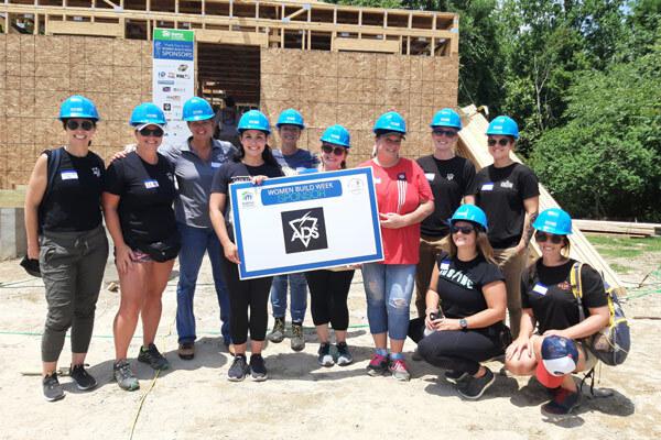 Women Posing for Humanity’s 2nd Annual Women Build Week
