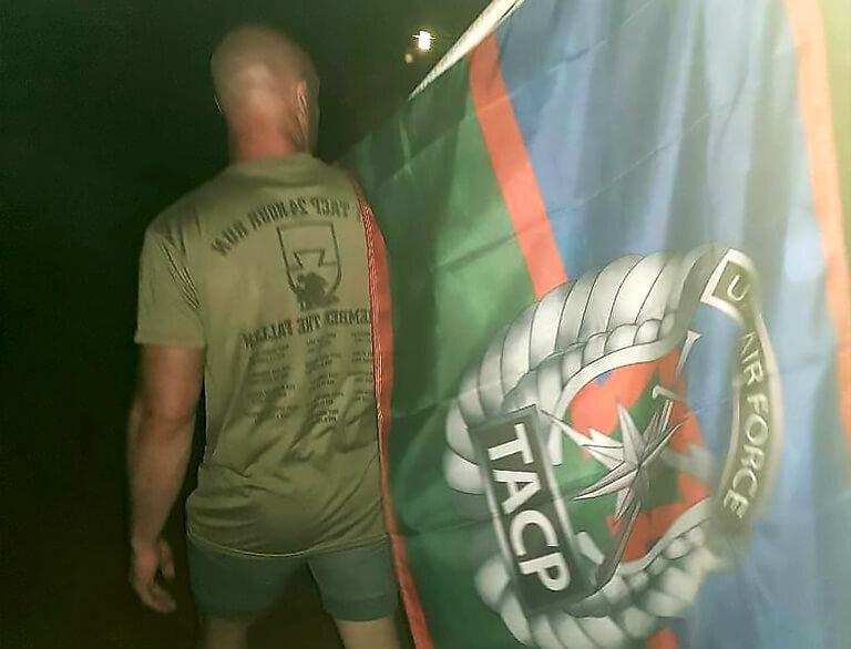 Regional Manager Justin Manalli Holding a Flag