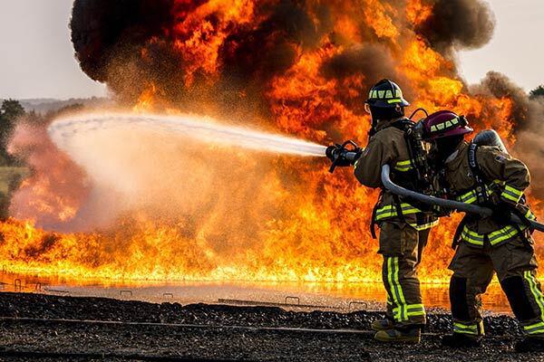 firefighters spray water