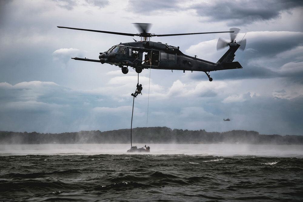 military helicopter above water