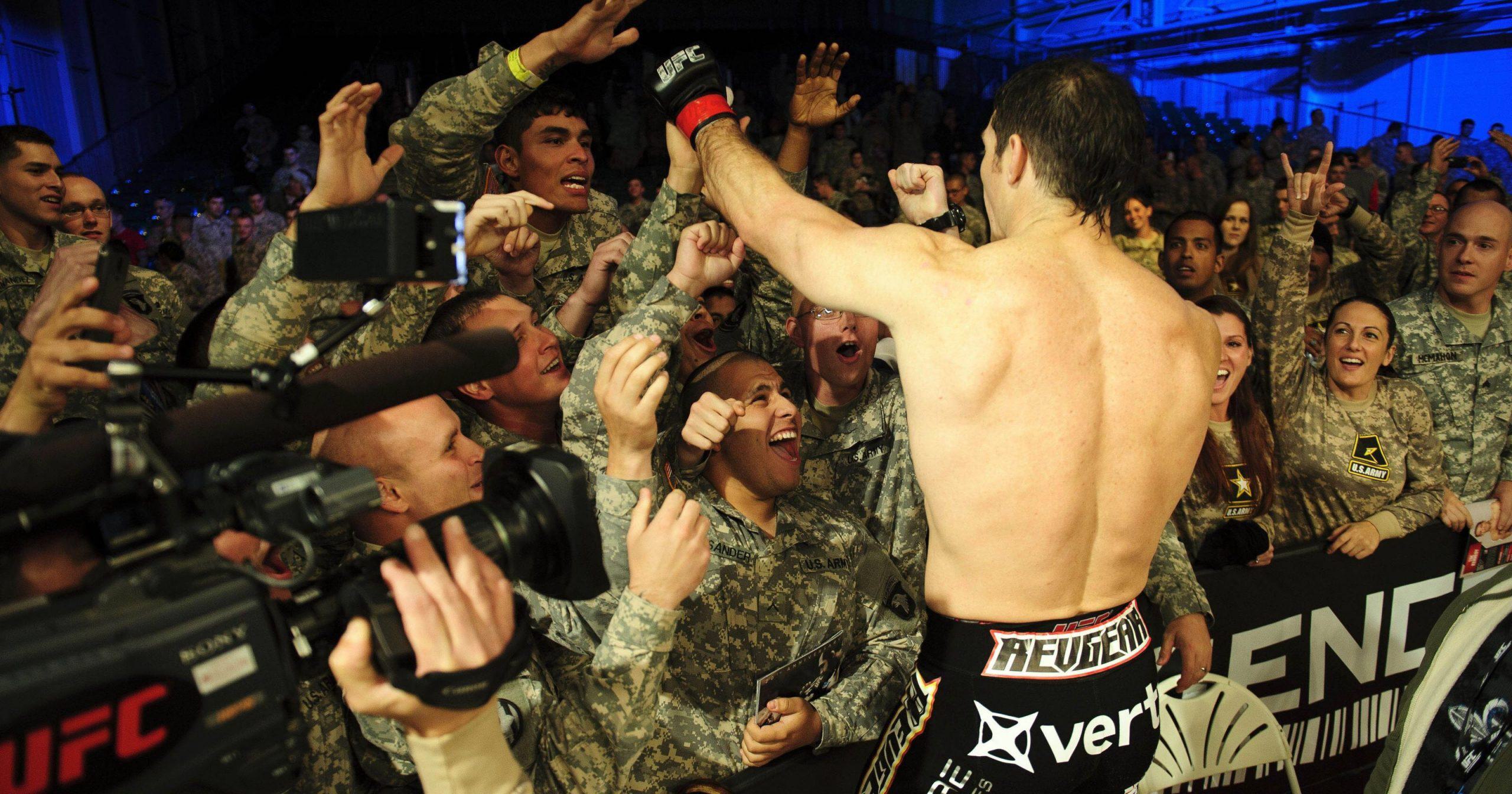army members cheer on boxer